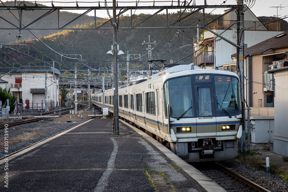Railway station with modern commuter train in Japan 