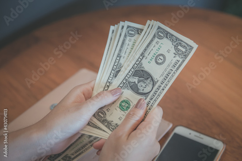 Close up, of male hands counting dollar bills, filtered image, business man working financial adviser and counting money banknotes.