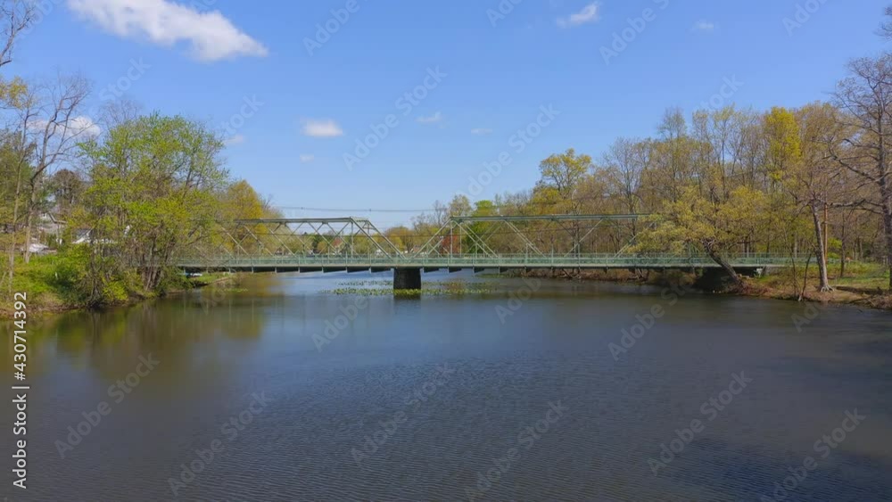 Beautiful Slider Left Shot of a Green Bridge Crossing Over a River Beautiful Slider Left Shot of a Green Bridge Crossing Over a River