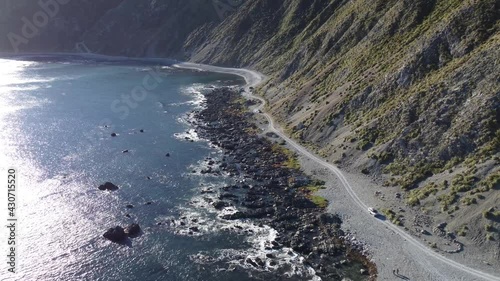Wallpaper Mural Descending towards a gravel coastal road with off road vehicles driving. Torontodigital.ca