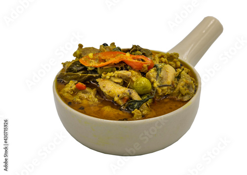 Green curry with chicken (Kaeng kheow hwan with chicken) in white bowl on isolated on white background with clipping path. Authentic Thai food, Selective focus. photo