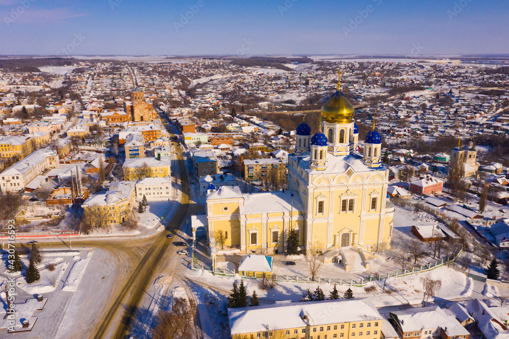 View from drone of Yelets Ascension Cathedral on background with cityscape on sunny winter day, Russia