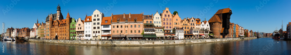 Panoramic view of Motlawa river embankment in Gdansk in sunny spring day, Poland.