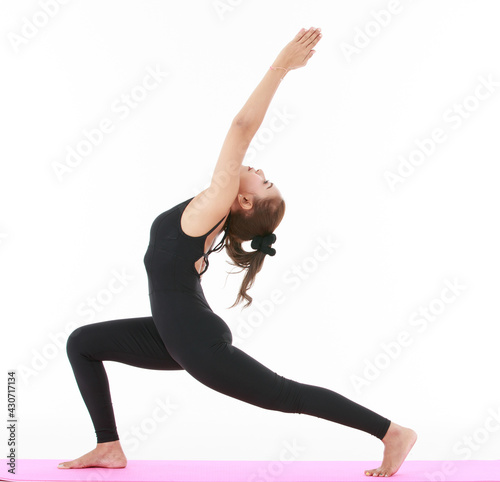 Asian woman doing Crescent Lunge pose