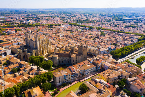 Picturesque aerial view of Narbonne cityscape overlooking ancient Gothic building of Cathedral of Saints Justus and Pastor, France photo