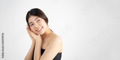 Portrait of beautiful asian woman makeup of cosmetic, girl hand touch cheek and smile attractive, face of beauty perfect with wellness isolated on white background with skin healthcare concept.