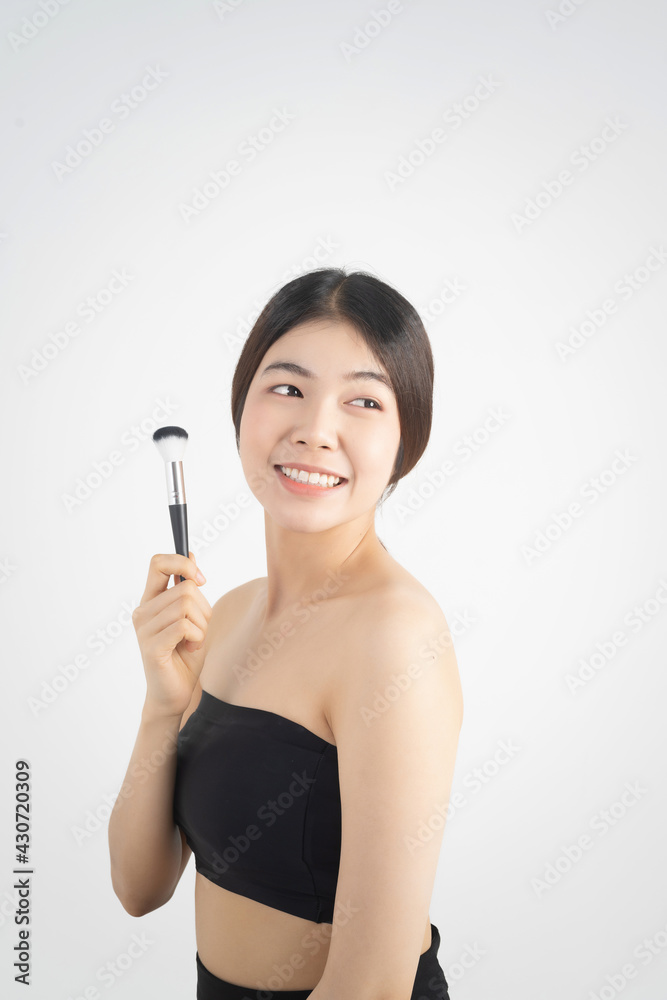 Portrait of beautiful asian woman makeup of cosmetic, girl hand touch cheek and smile attractive, face of beauty perfect with wellness isolated on white background with skin healthcare concept. Portrait of beautiful asian woman makeup of cosmetic, girl hand touch cheek and smile attractive, face of beauty perfect with wellness isolated on white background with skin healthcare concept.