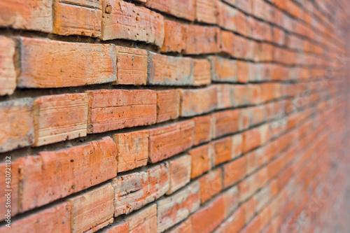 Perspective of a red brick wall