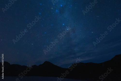 Southern Cross and Milky Way over Promontory Lake, Western Arthur Range, Southwest National Park, Tasmania. World Heritage Area
