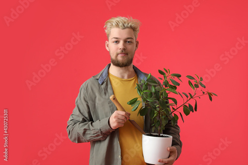 Young male gardener on colo...