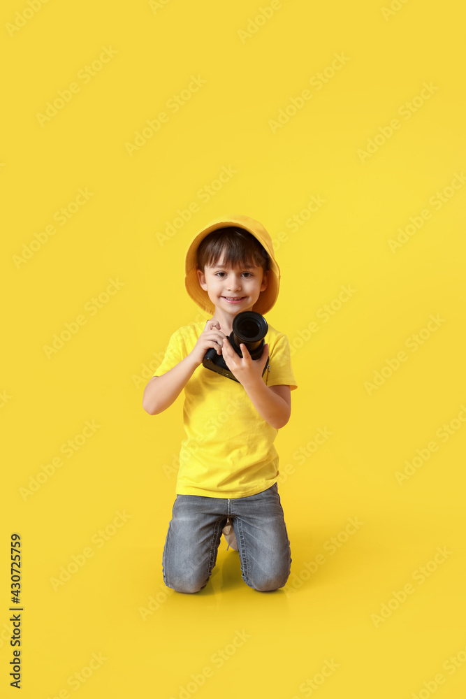 Cute little photographer on color background Cute little photographer on color background