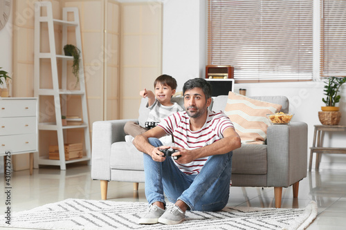 Father and little son playi...