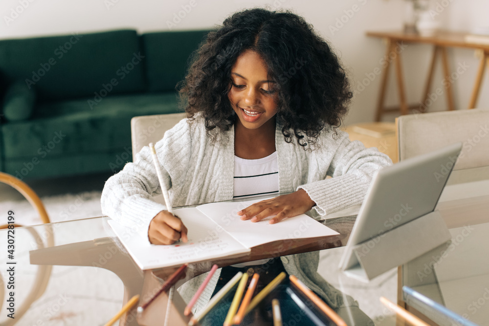 Girl completing her homework Girl completing her homework