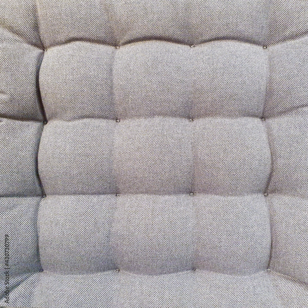 square grey pillow for chairs.Top view, textured background square grey pillow for chairs.Top view, textured background