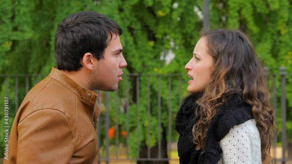 face to face - young couple face to face arguing accusing each other face to face - young couple face to face arguing accusing each other