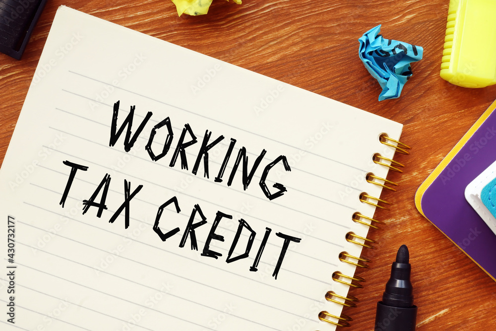 Naklejka premium Business concept about WORKING TAX CREDIT question marks with inscription on the piece of paper.