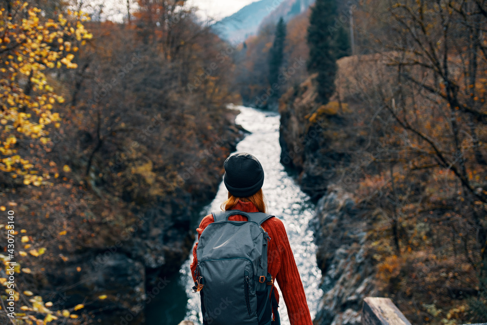 woman hiker backpack mountains river fresh air