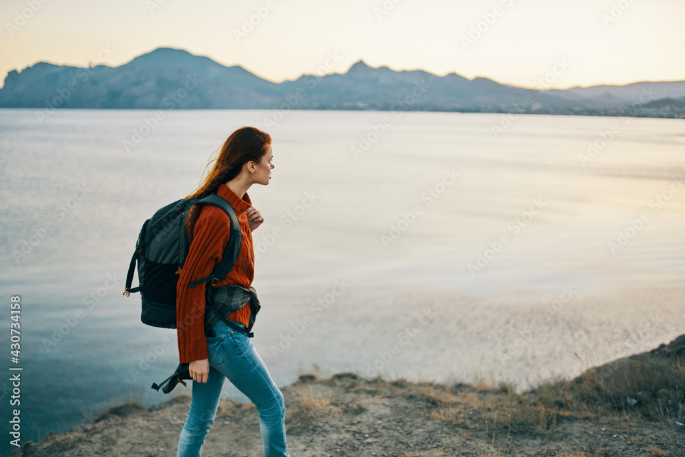 beautiful woman who lock on her back tourism travel mountains landscape sunset model