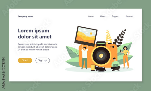 Tiny people taking photo flat vector illustration. Cartoon guy holding full picture. Big camera on background. Artistic occupation and photography courses concept
