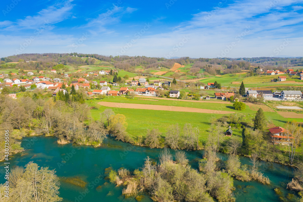 Beautiful countryside landscape, Mreznica river and Belavici village from air, Croatia