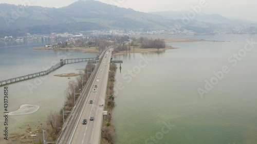 Wallpaper Mural Aerial following a black car driving over the dam, Seedamm, Switzerland Torontodigital.ca