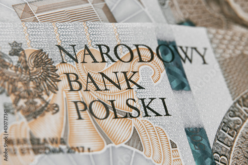 Close up on national polish bank of new Polish banknotes five hundred zloty. Macro photo of narodowy bank polski sign on PLN bill. Shallow focus. Close-up with fine and sharp texture photo