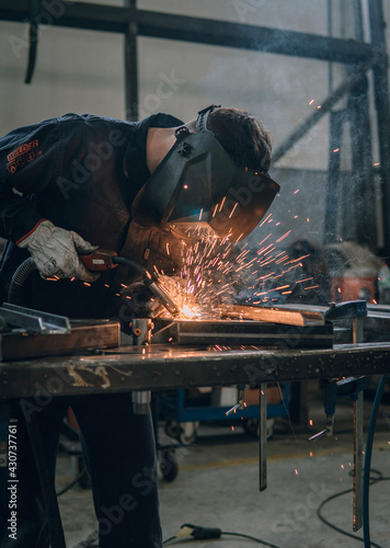 welder working hard in factory  photo