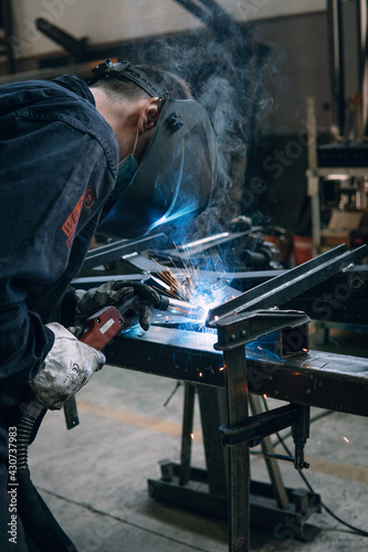 welder working hard in factory 