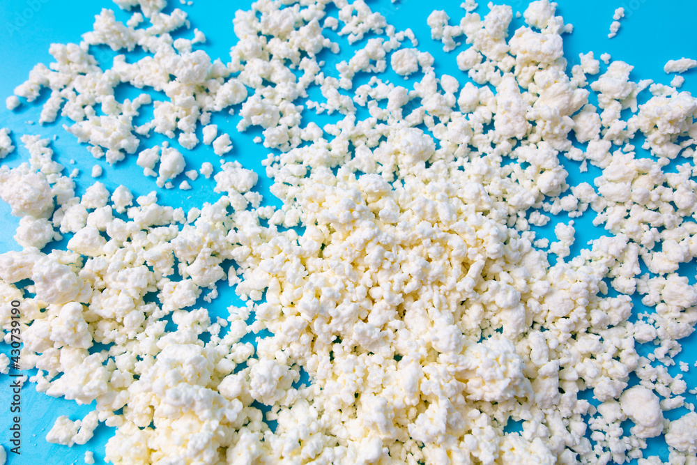 Milk curd on a blue background. Milk curd on a blue background.