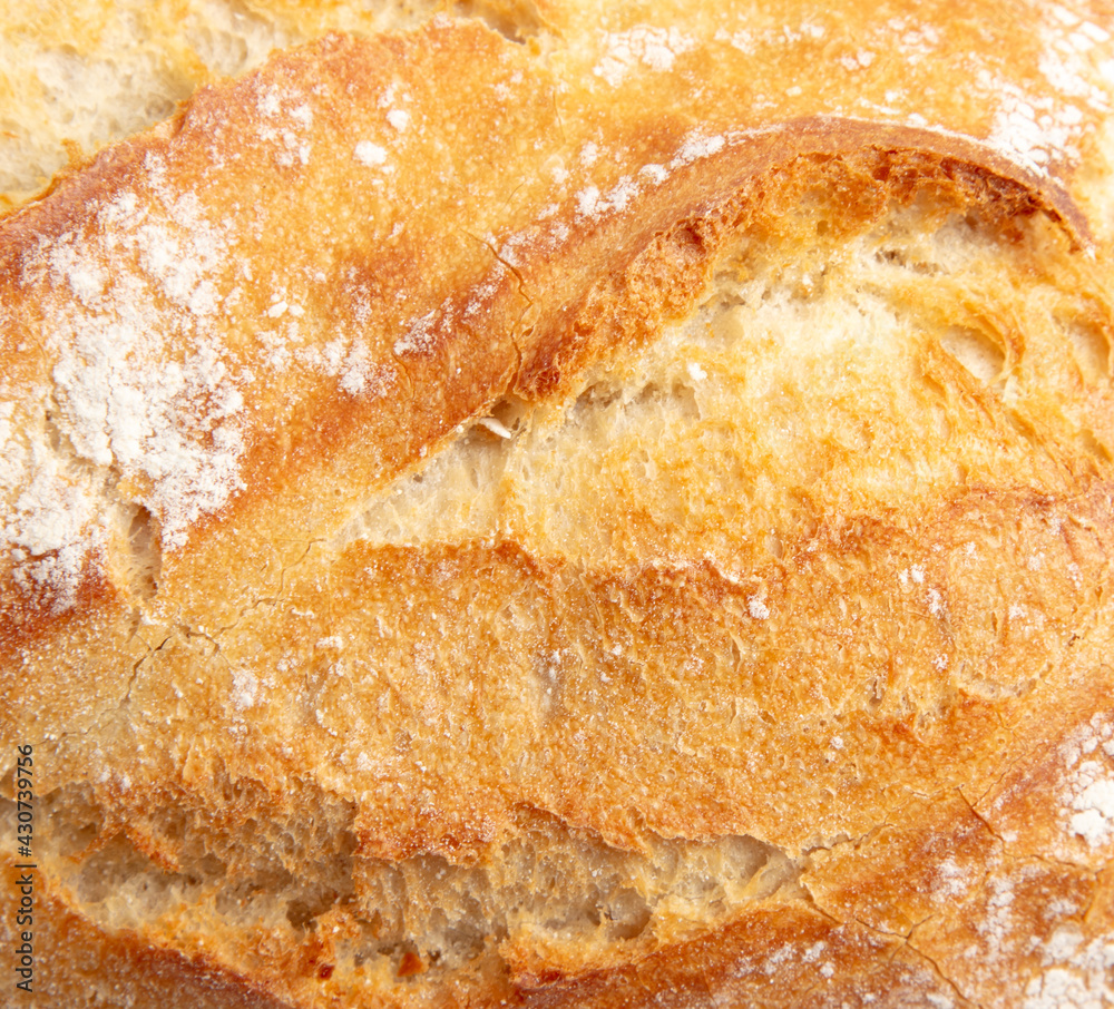 Fresh bread crust as background.