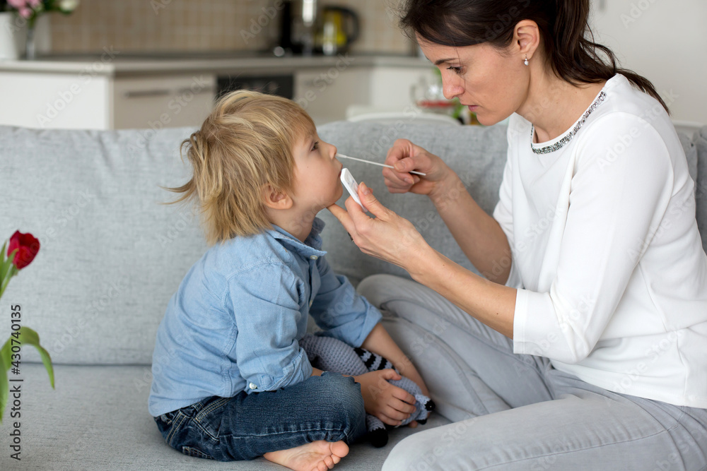 Mother, testing her child for covid at home, making home allowed swab tests Mother, testing her child for covid at home, making home allowed swab tests