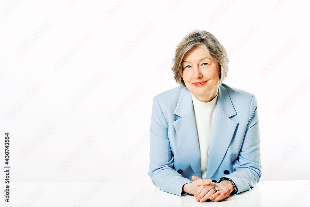 Studio portrait of middle age woman posing on white background Studio portrait of middle age woman posing on white background