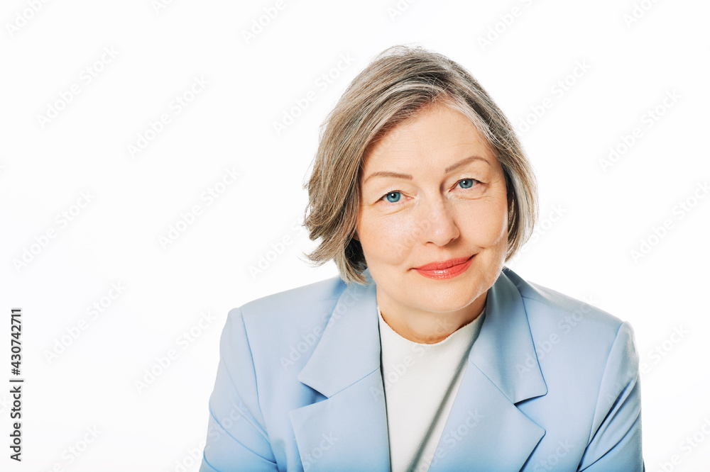 Studio portrait of middle age woman posing on white background Studio portrait of middle age woman posing on white background