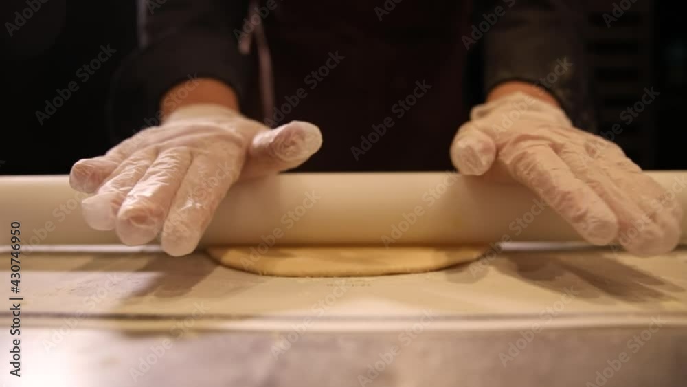 Female confectioner prepares the base for the cake Female confectioner prepares the base for the cake