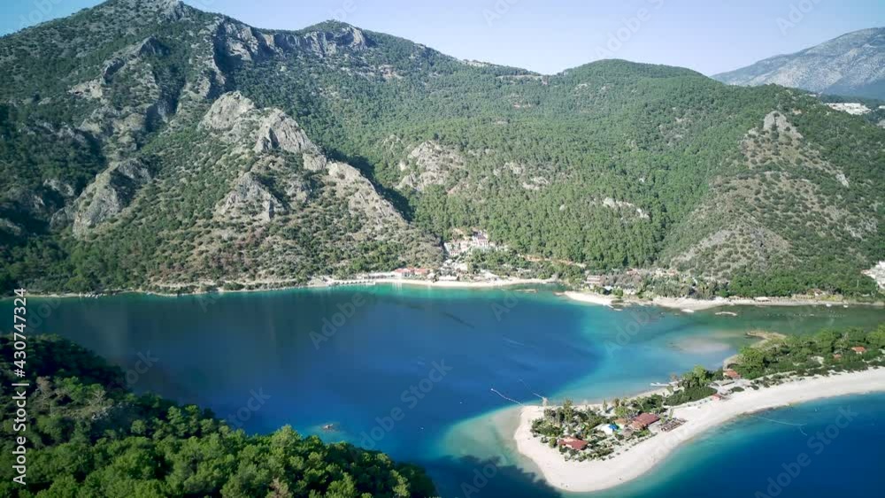 Amazing beautiful panoramic view from drone of natural park of Oludeniz and Fethiye blue lagoon and tranquil aquamarine dead sea.
Amazing beautiful panoramic view from drone of natural park of Oludeniz and Fethiye blue lagoon and tranquil aquamarine dead sea.
