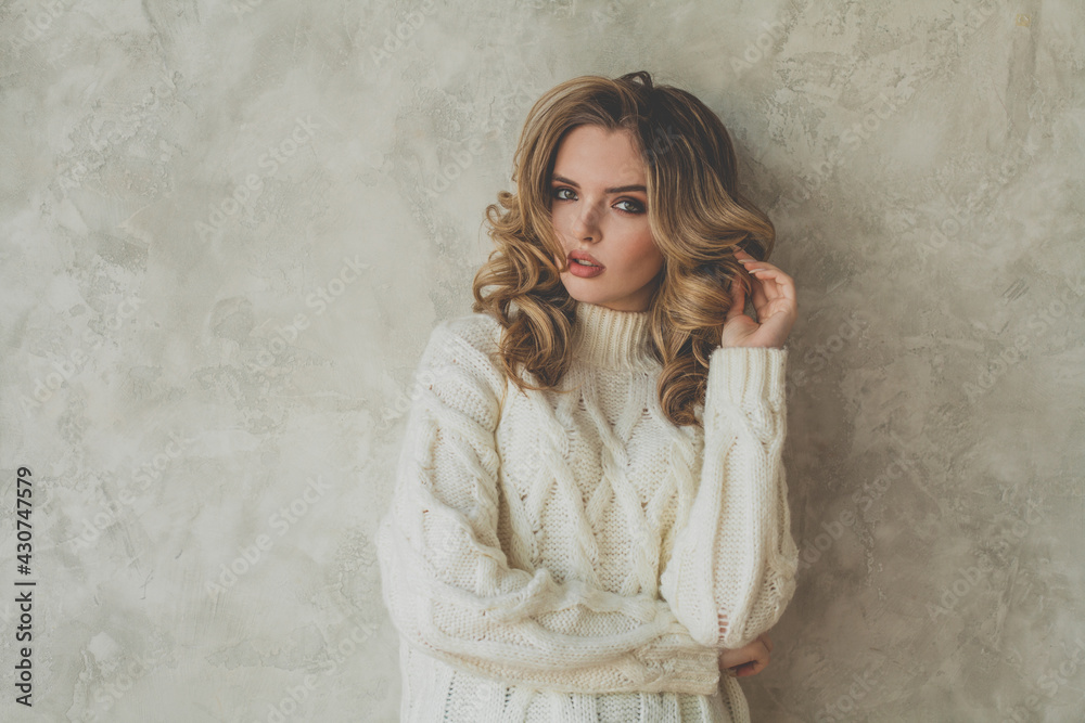 Stylish woman with healthy curly hair on gray background Stylish woman with healthy curly hair on gray background
