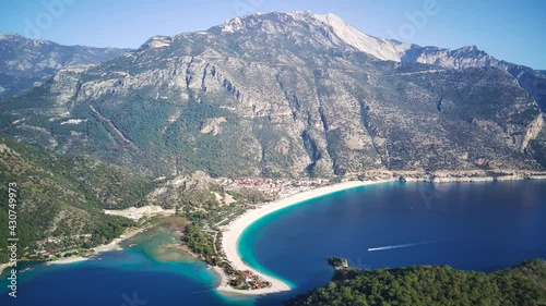 Amazing high angle top drone view on world famous paragliding and parasailing turkish spot for extrim parachute sport in Oludeniz in Fethiye, Turkey
