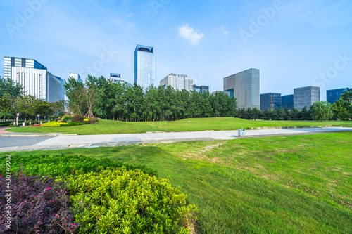 Photography cityscape and skyline of shanghai from meadow in park