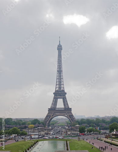 Paris  France-May 05  2017: View of the bridge Jena and the Eiffel Tower. Around the walk tourists and go cars © Aleksandr