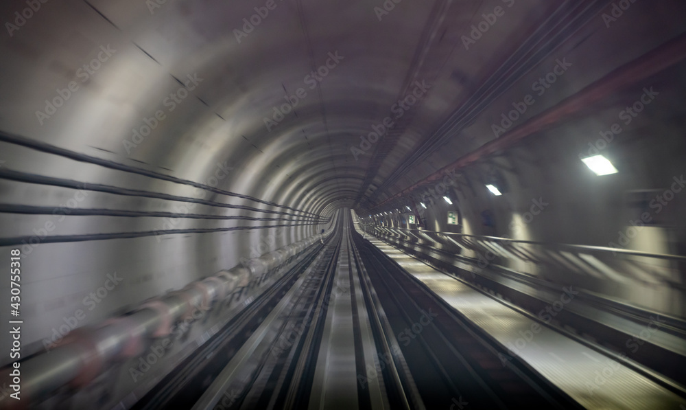 Underground one way metro subway tunnel with blur effect. defocus