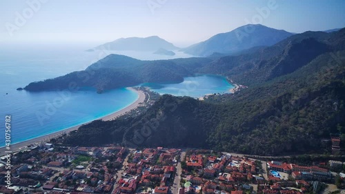 Amazing high angle top drone view on world famous paragliding and parasailing turkish spot for extrim parachute sport in Oludeniz in Fethiye, Turkey
