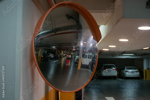 Fototapeta Curve mirror at a basement parking