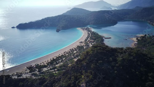 Amazing high angle top drone view on world famous paragliding and parasailing turkish spot for extrim parachute sport in Oludeniz in Fethiye, Turkey
