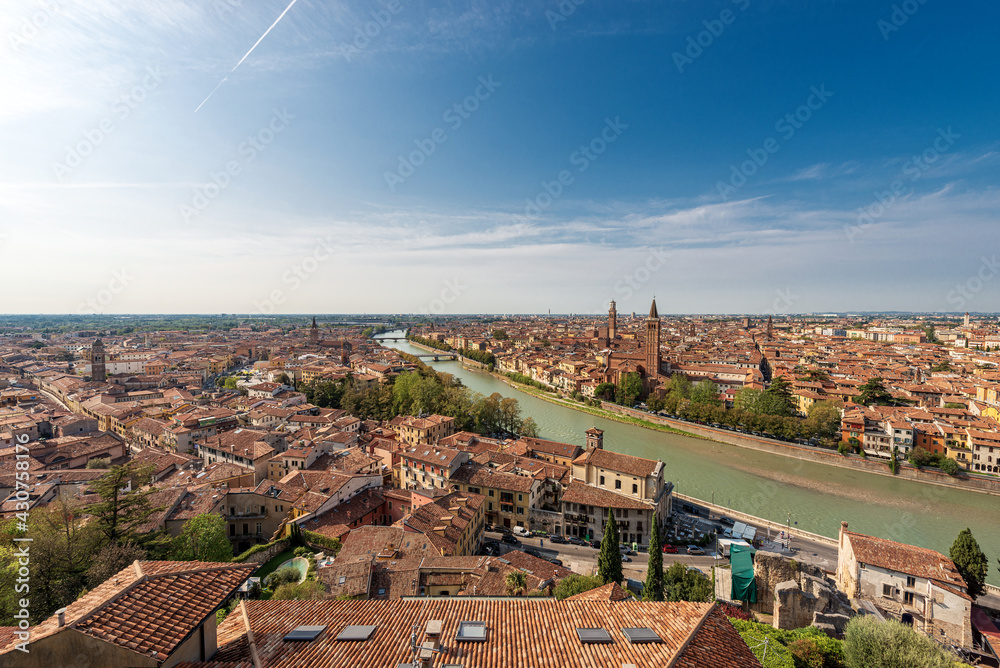 Verona cityscape seen from the hill at summer with the River Adige, Lamberti Tower, and the Church of Santa Anastasia. UNESCO world heritage site. Veneto, Italy, Europe.