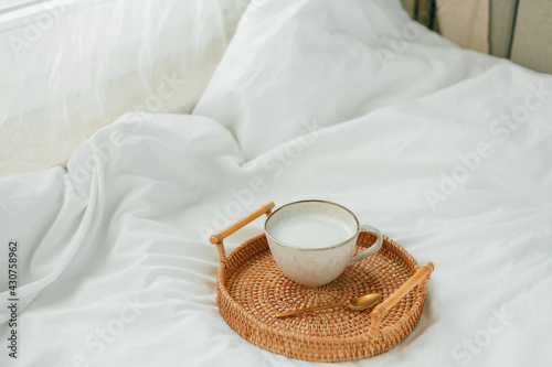 Breakfast in bed, cappuccino, wicker tray, spring, home decor. Cozy.