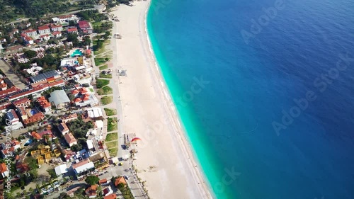 Amazing high angle top drone view on world famous paragliding and parasailing turkish spot for extrim parachute sport in Oludeniz in Fethiye, Turkey
