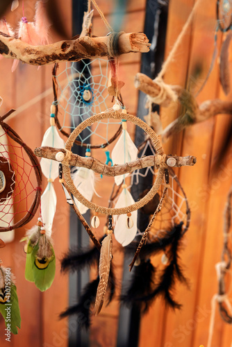 Round handmade dream catcher with feathers and seashells