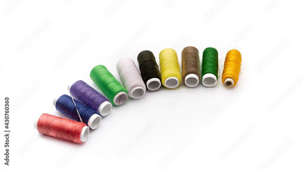 Thread in different colors on white background Thread in different colors on white background