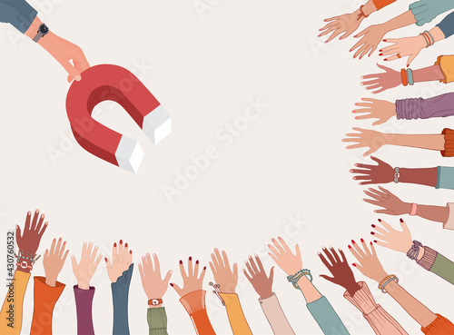 Professional influencer or leader concept. Ability to persuade and motivate. Leadership. Training. Hand holding a magnet which attracts many hands diverse people. Followers