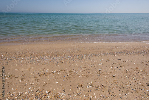 Calm sea and sandy tropical beach summer background